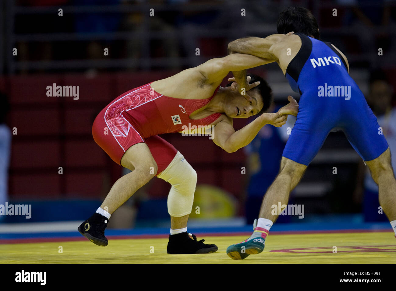 Dae Jong Kim KOR L competing against Muzad Ramazanov MKD in the 60kg freestyle wrestling 1 8 final event at the 2008 Olympic Sum Stock Photo