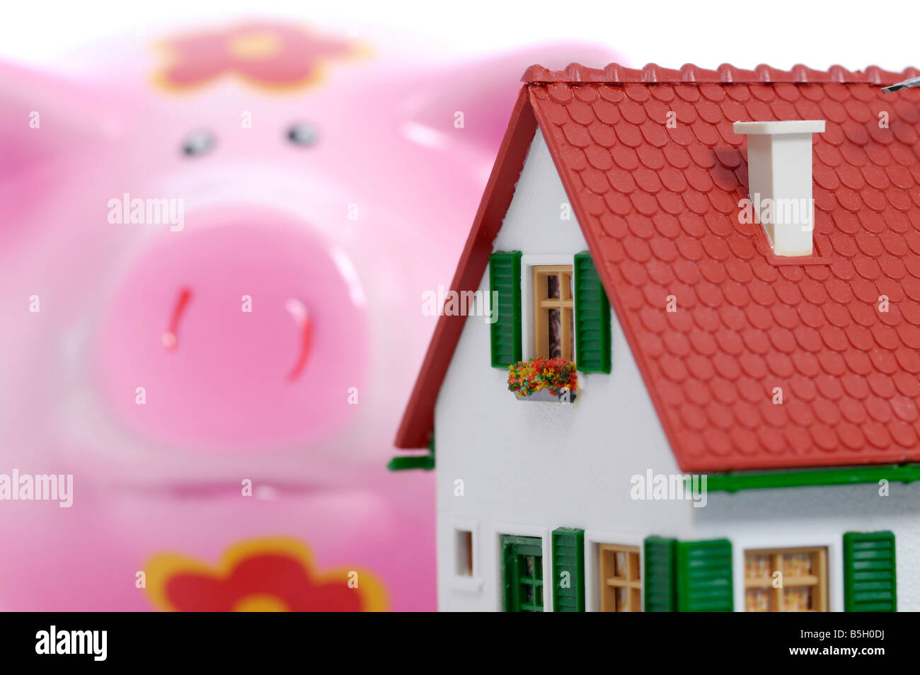 toy house and a saving box Stock Photo