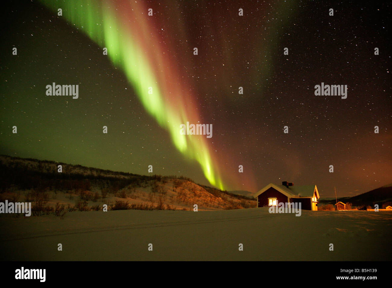 Hut in Northern Norway in the arctic circle with the Arora Borealis or Northern lights overhead Stock Photo