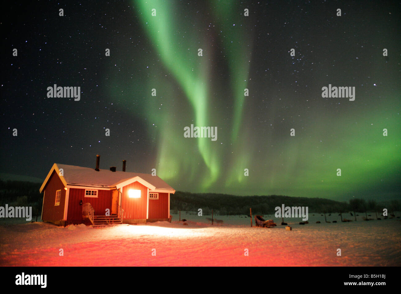 Hut in Northern Norway in the arctic circle with the Arora Borealis or Northern lights overhead Stock Photo
