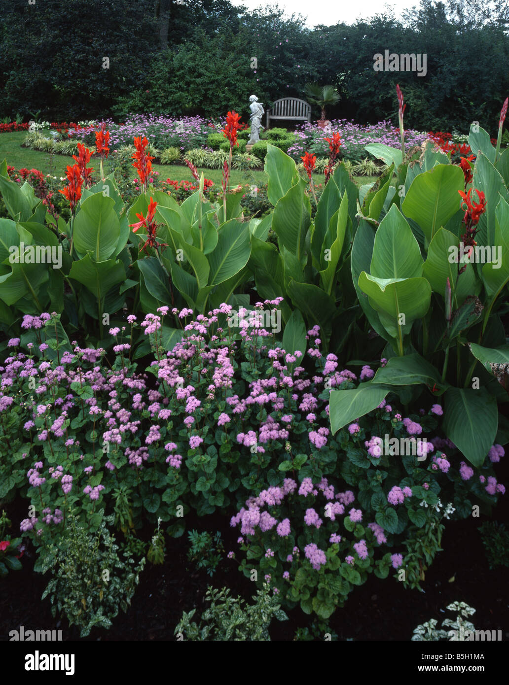 Formal Garden with Statue and Bench Stock Photo - Alamy