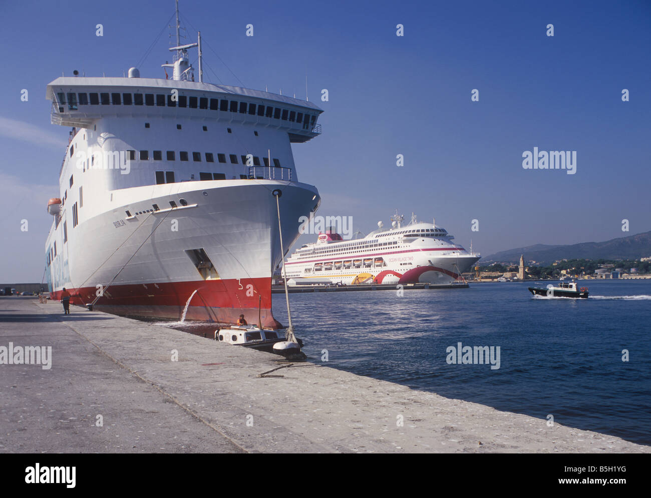 Freight ferry 'Borja' + Cruise Ship 'Ocean Village Two' and historic Porto Pi lighthouse, in the Port of Palma de Mallorca. Stock Photo