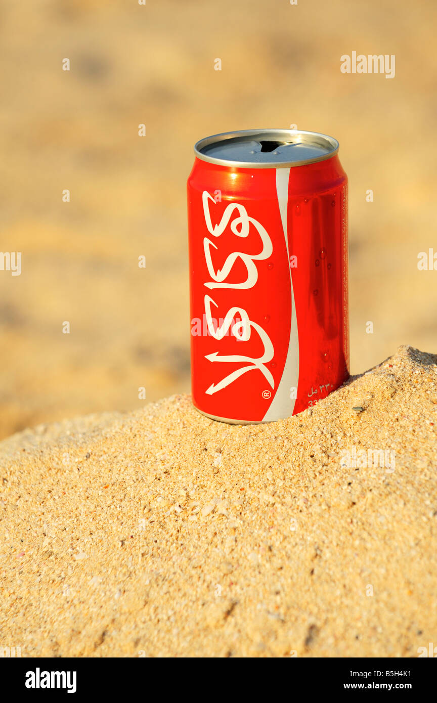 Arabic Coca Cola on the beach, Ras Al Khaimah UAE Stock Photo