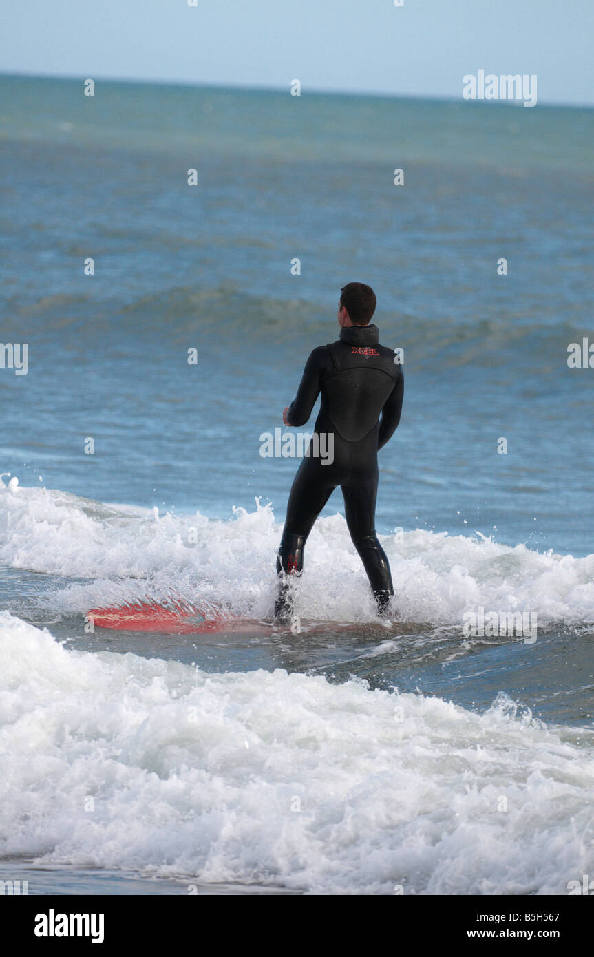 Man surfing on Aberdeen Beach Scotland UK Stock Photo