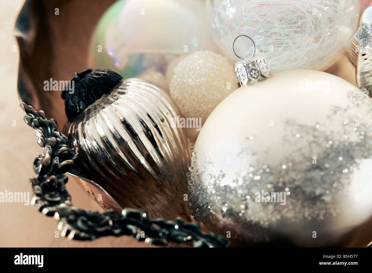 white and silver christmas ornaments gathered in a antique silver bowl stock image - Antique Silver Christmas Decorations white and silver christmas ornaments gathered in a antique silver bowl stock image - Antique Silver Christmas Decorations