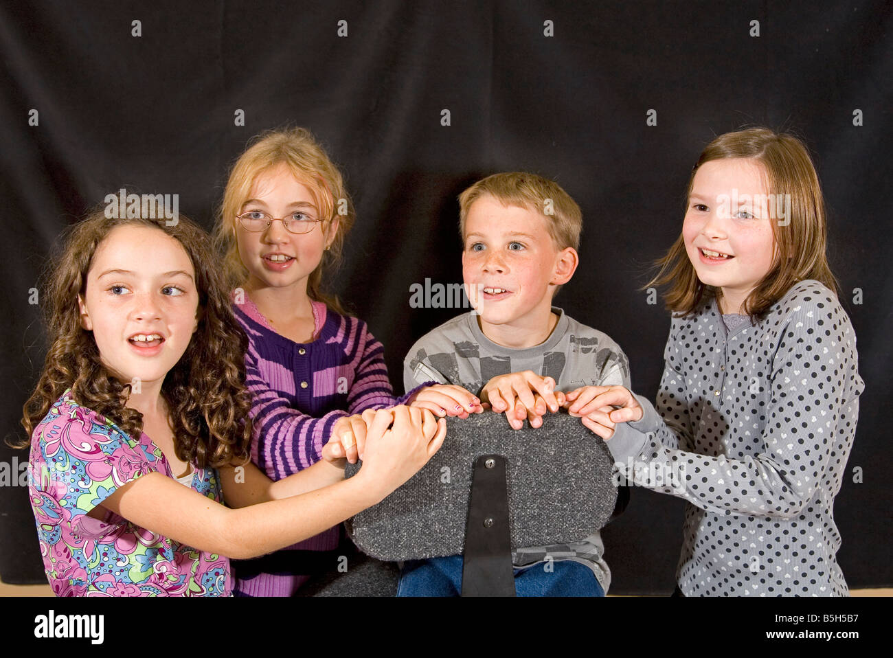 A children s choir sings an old folk song at a rehersal in Bend Oregon Stock Photo