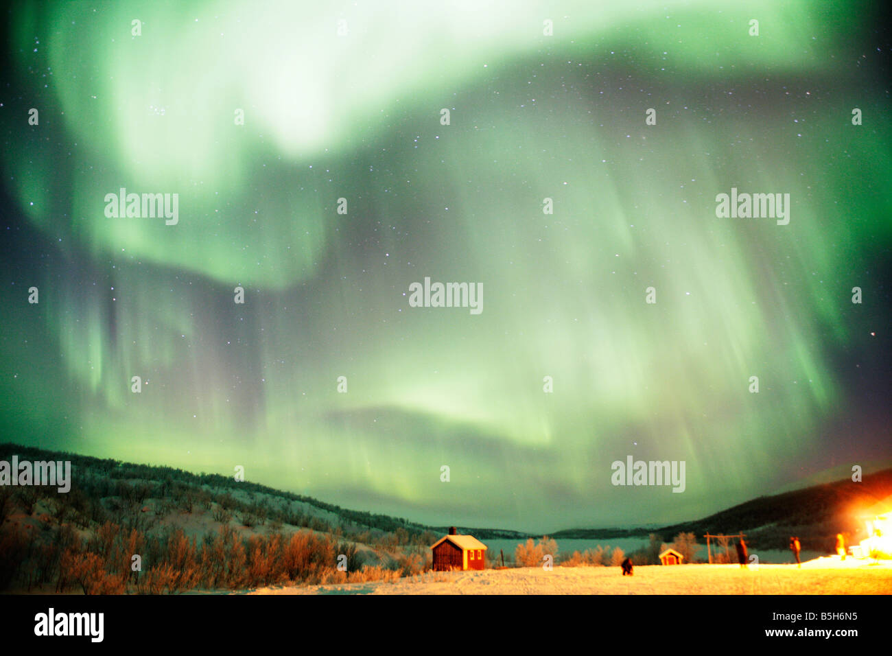 Huts in the Arctic Northern Norway at night under the Noerthern Lights or the Arora Borialis Stock Photo