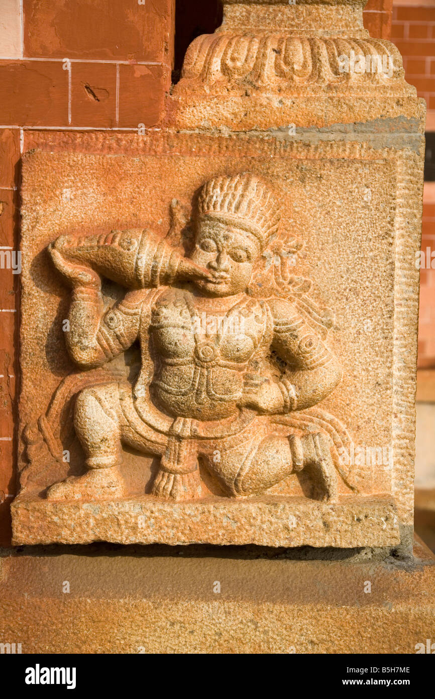 A carved deity blows a conch. This is a detail from the Kuthiramalika Puthenmailika Palace in Thiruvananthapuram, Kerala. Stock Photo