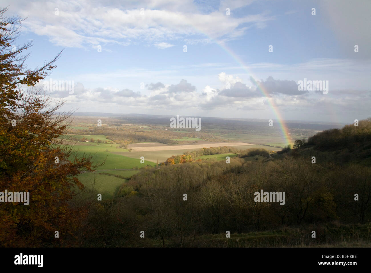 A rainbow can be seen across the Weald from the South Downs near Lewes