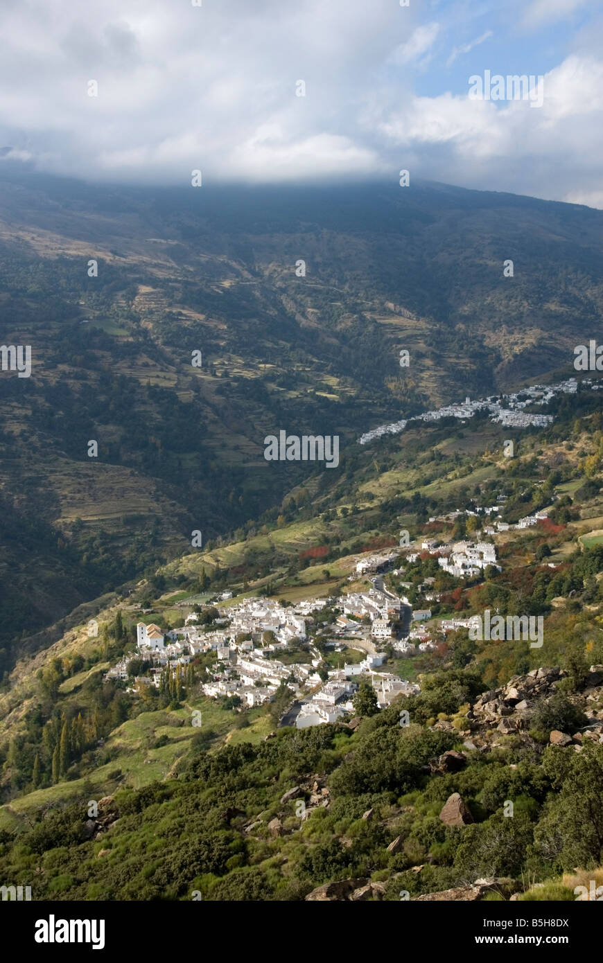 Whitewashed Andalusian villages of Bubion bottom and Capileira in the Sierra Nevada mountain range Alpujarra Spain Stock Photo