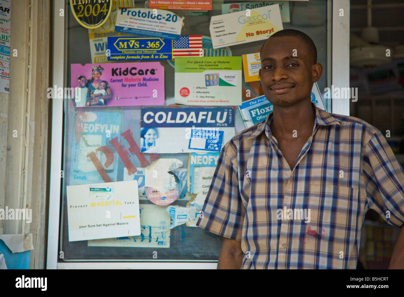 A Proprietary Patent Medicine Vendor (PPMV) stands in front of his shop