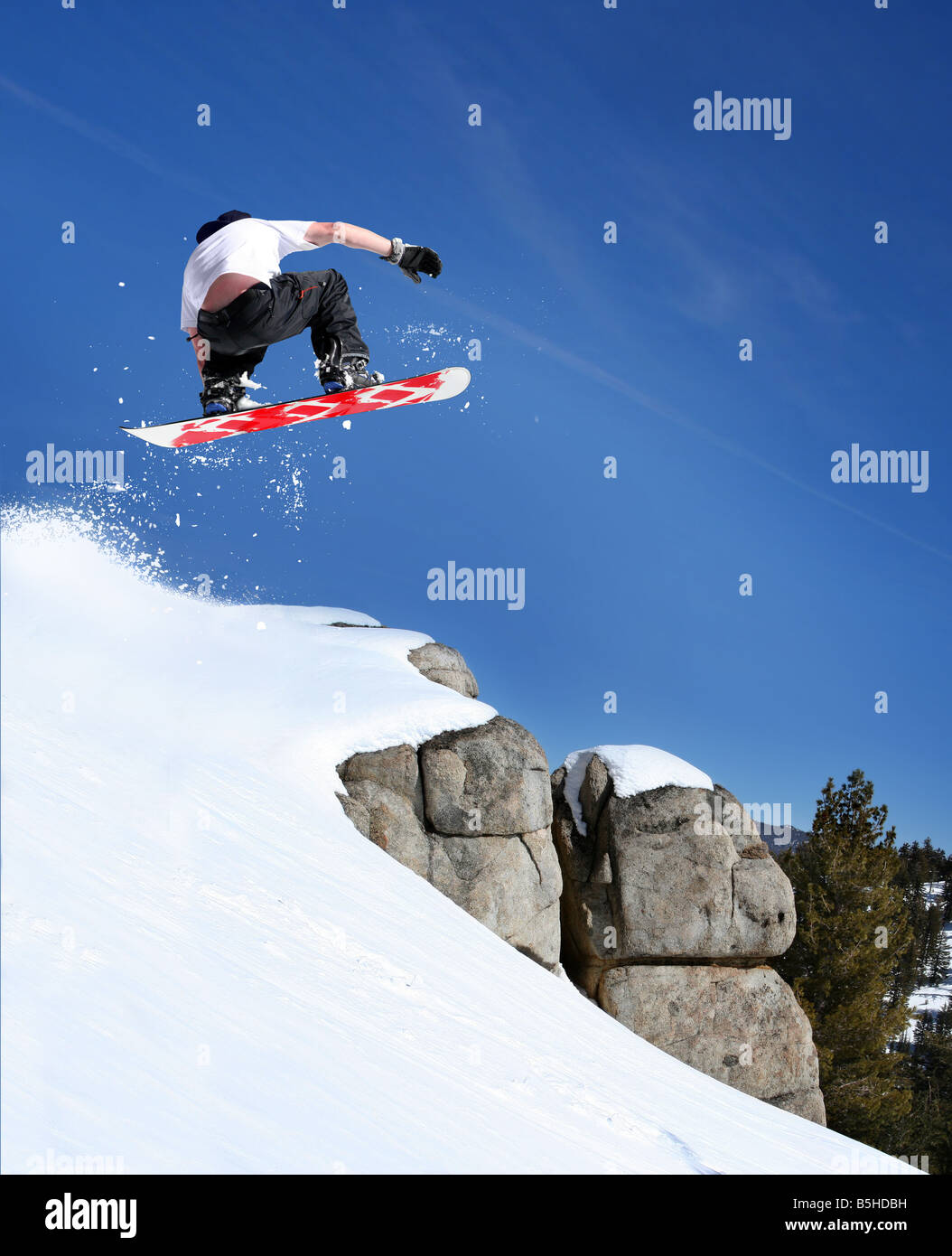 Snowboarder jumping Stock Photo