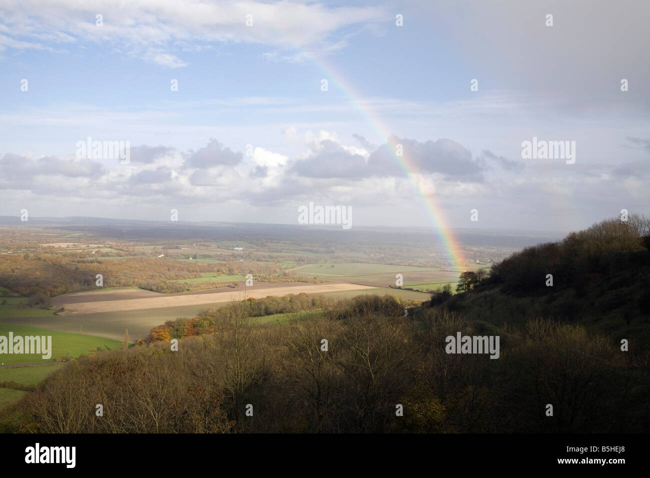A rainbow can be seen across the Weald from the South Downs near Lewes