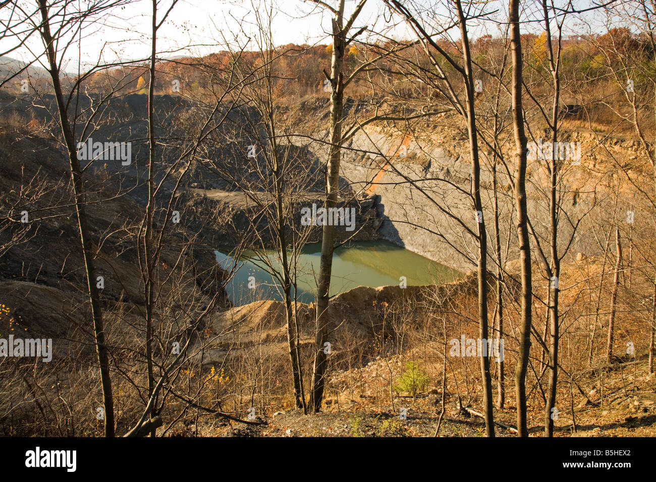 An abandoned openpit coal mine is filled with water. The mine is in