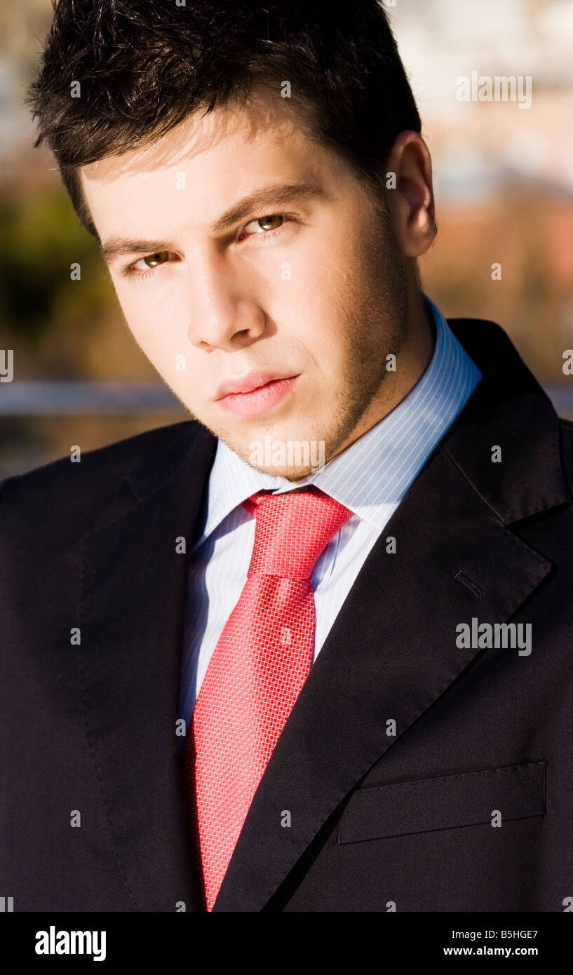 Handsome businessman portrait elegantly dressed Stock Photo - Alamy