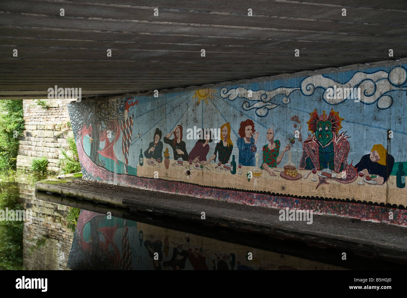 dh Leeds Liverpool Canal SALTAIRE WEST YORKSHIRE UK Graffiti painting in canal underpass wall art mural urban artist drawing Stock Photo