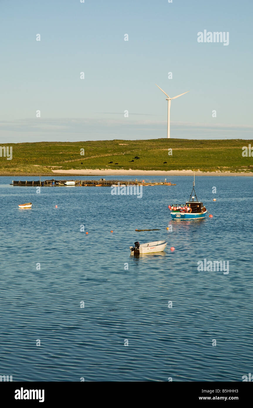 dh Weddell Sound BURRAY ORKNEY Fishing boat fish farm and wind turbine Stock Photo