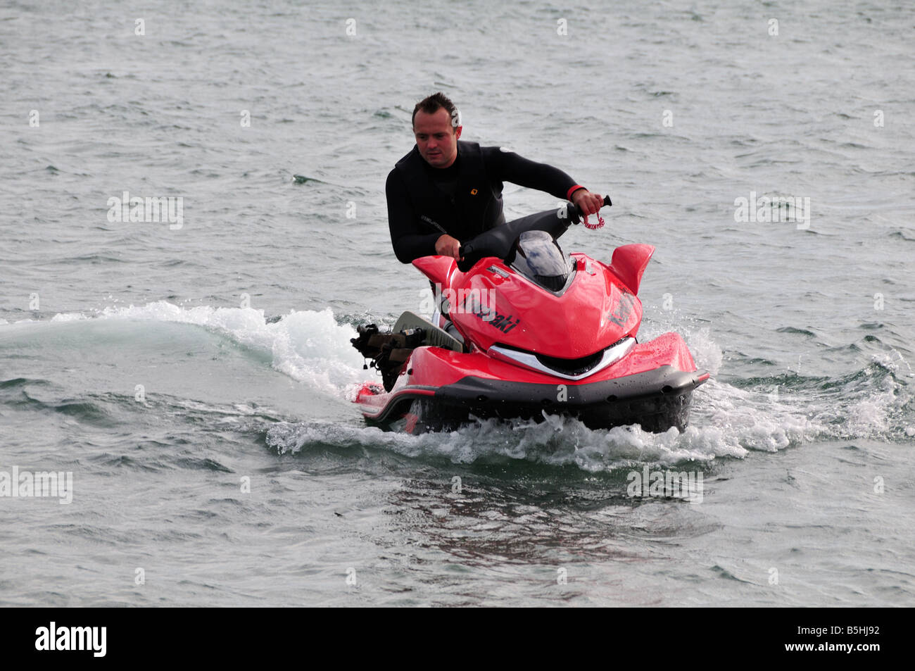 Man using a jet ski on Morfa Gors Beach Abersoch Llyn Peninsula Gwynedd
