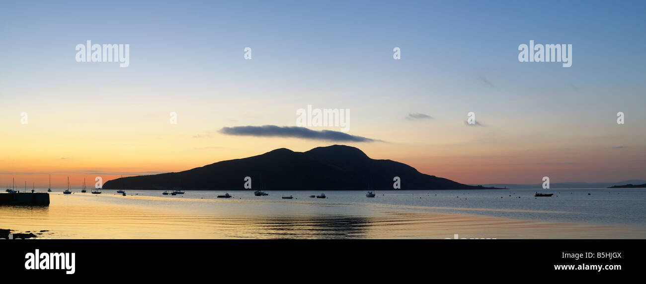 Holy Island off Isle of Arran, North Ayrshire, Scotland, UK. Seen across Lamlash Bay at sunrise. Stock Photo