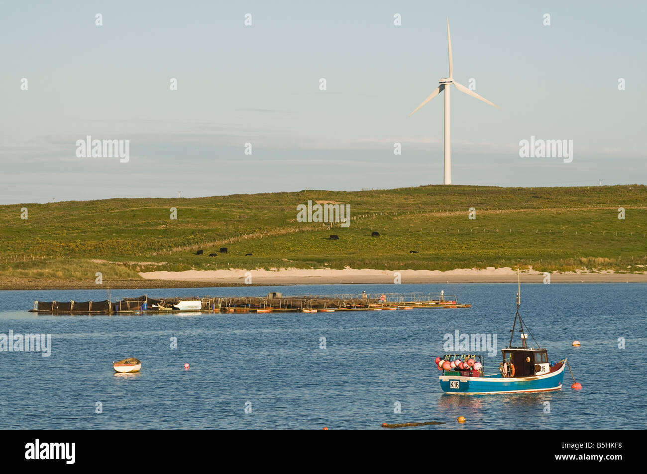 dh Weddell Sound BURRAY ORKNEY Fishing boat sea windpower seacoast windturbine energy coast scotland fish farm wind turbine Stock Photo
