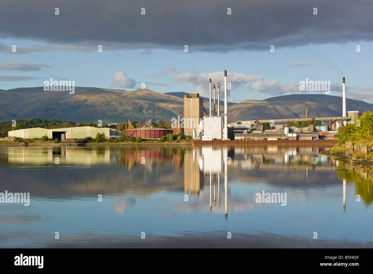 The United Glass Limited Glass Works in Alloa, Clackmannanshire, Scotland, UK. Reflected in the River Forth Stock Photo