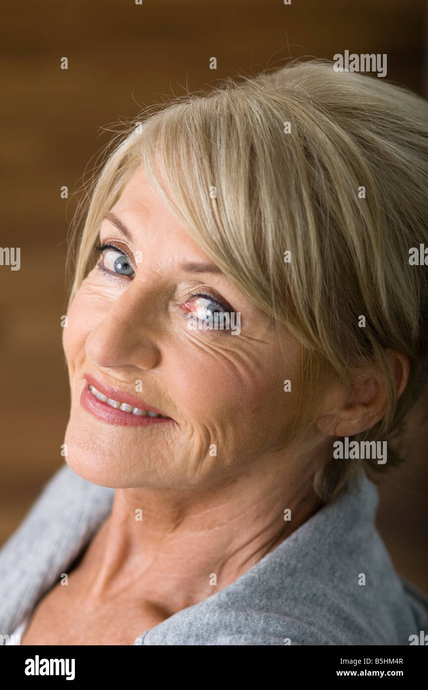 Senior woman smiling at camera Stock Photo - Alamy