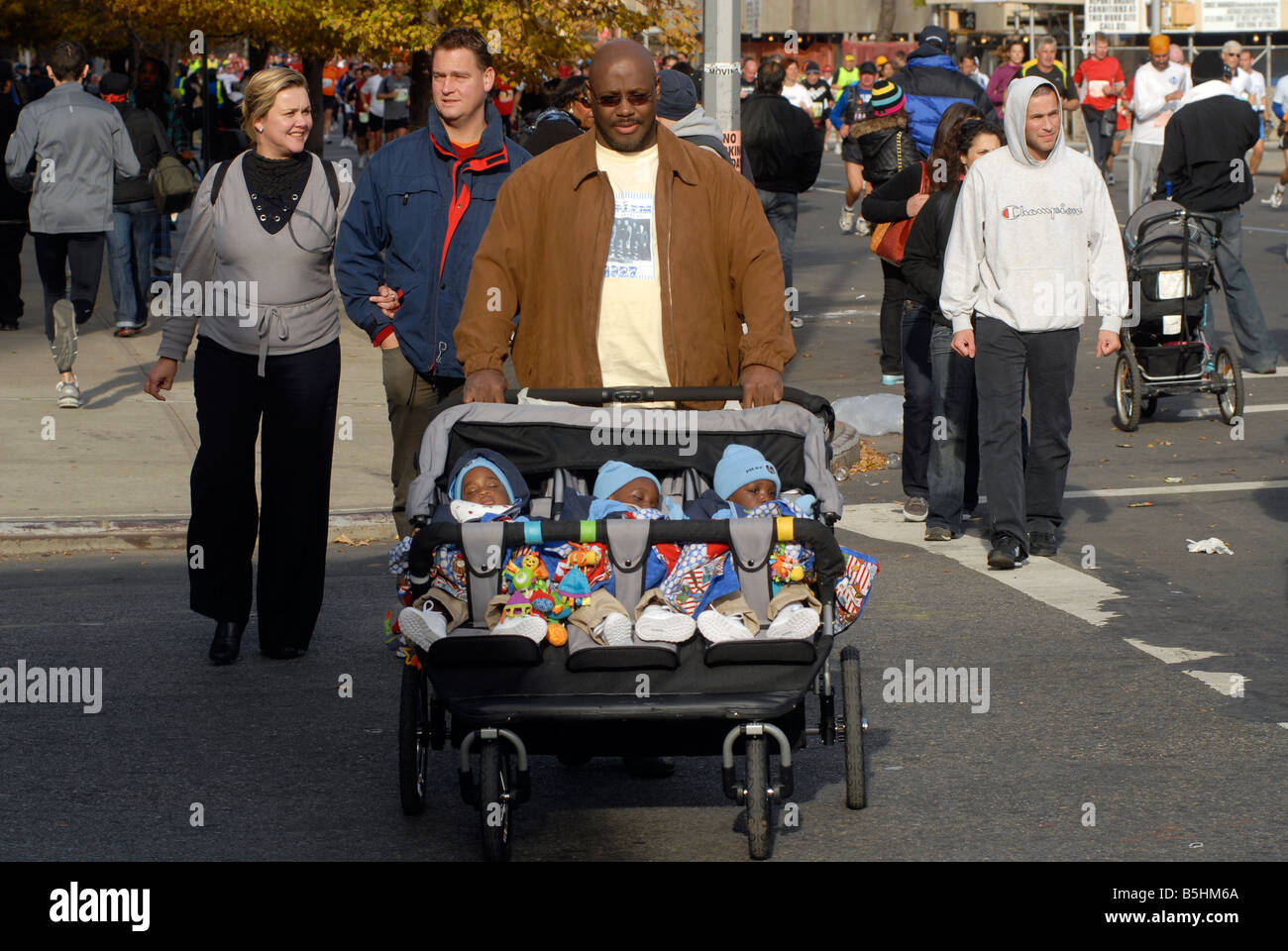 African American father with triplets on November 2 2008 in the Harlem neighborhood of New York Richard B Levine Stock Photo