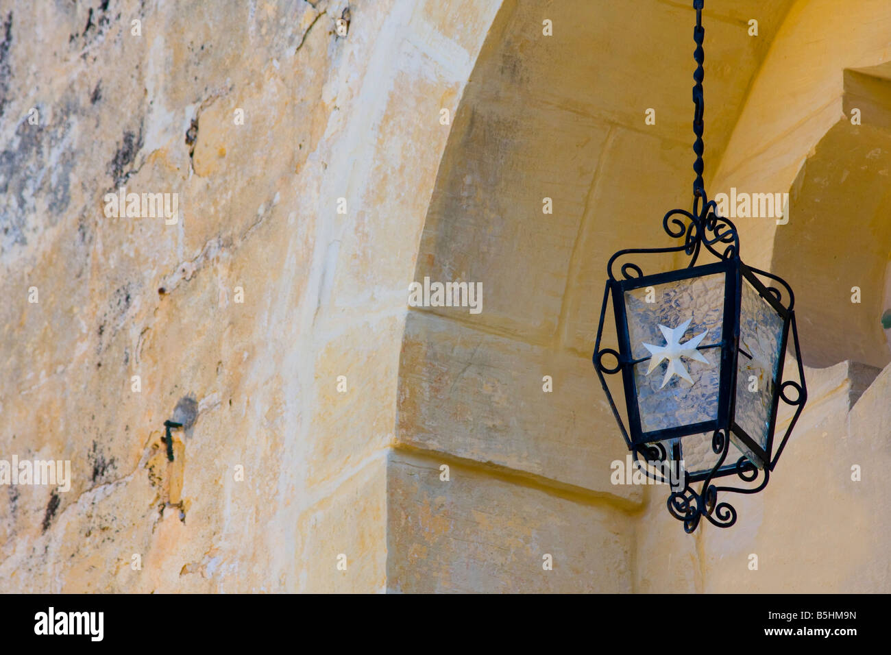 Cast iron lamp with the eight pointed cross at Mdina Stock Photo