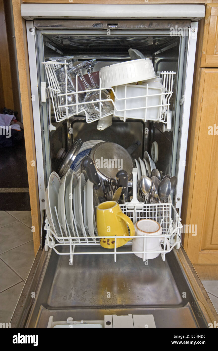 This is a domestic dishwasher full of freshly washed clean dishes crockery and cutlery Stock Photo Alamy
