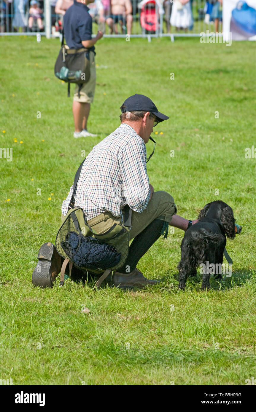 'Gun Dog' gundog Handler with a Working Dog Cowpie Rally Betchworth Surrey Display Stock Photo