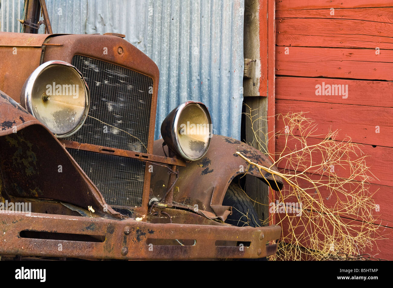 Rusty old truck and tumbleweed in Shaniko ghost town Wasco County Oregon Stock Photo