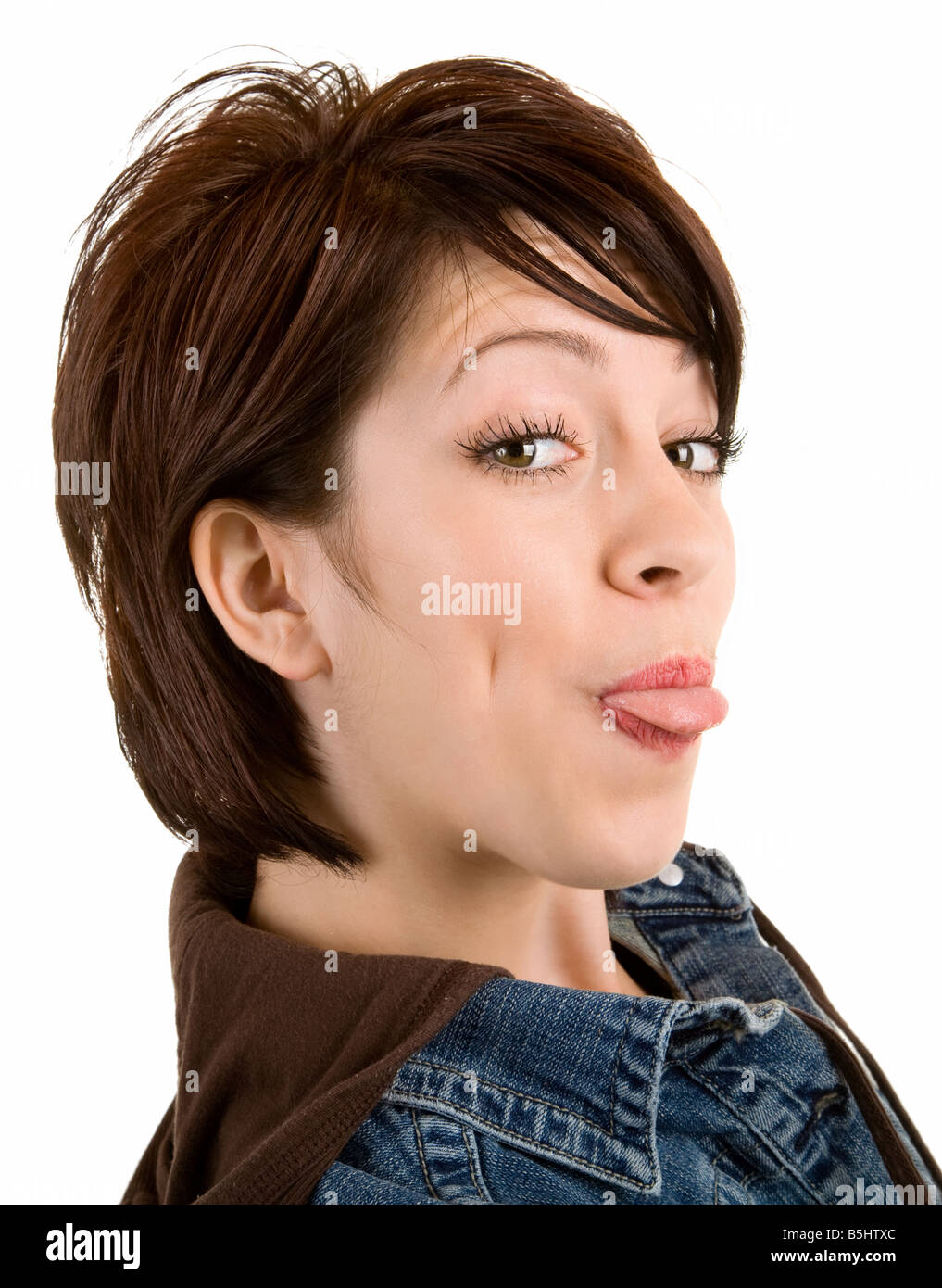 Closeup of woman sticking out her tongue Stock Photo