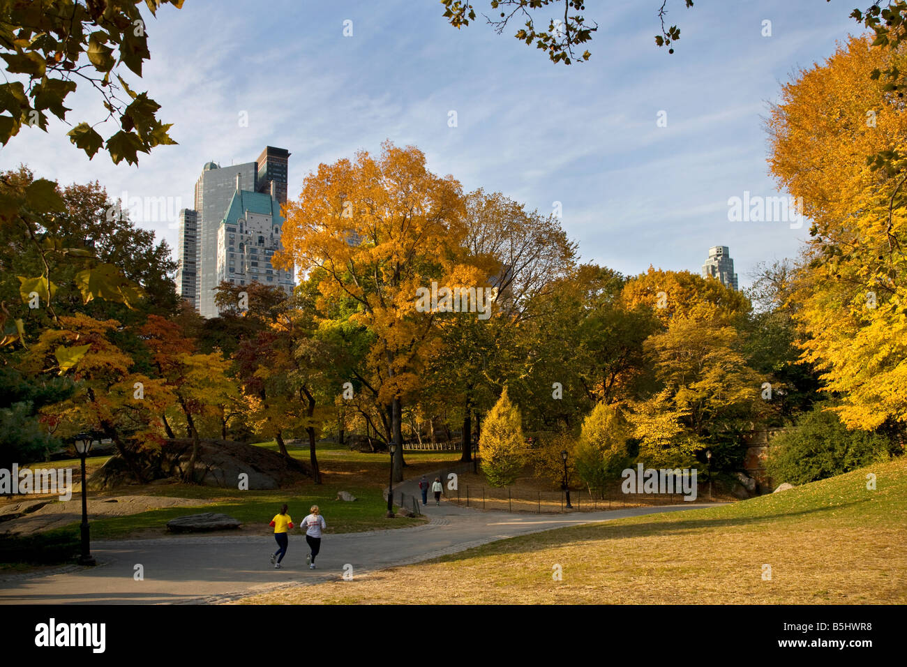 Central Park with joggers in autumn fall ,new york,new york,america,usa. Stock Photo