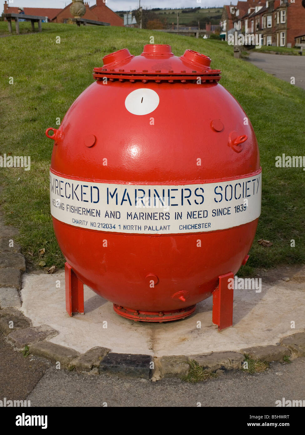 A World War 2 Mine Now Used As A Collection Box For The Wrecked Mariners Society In Robin Hoods Bay North Yorkshire Stock Photo Alamy