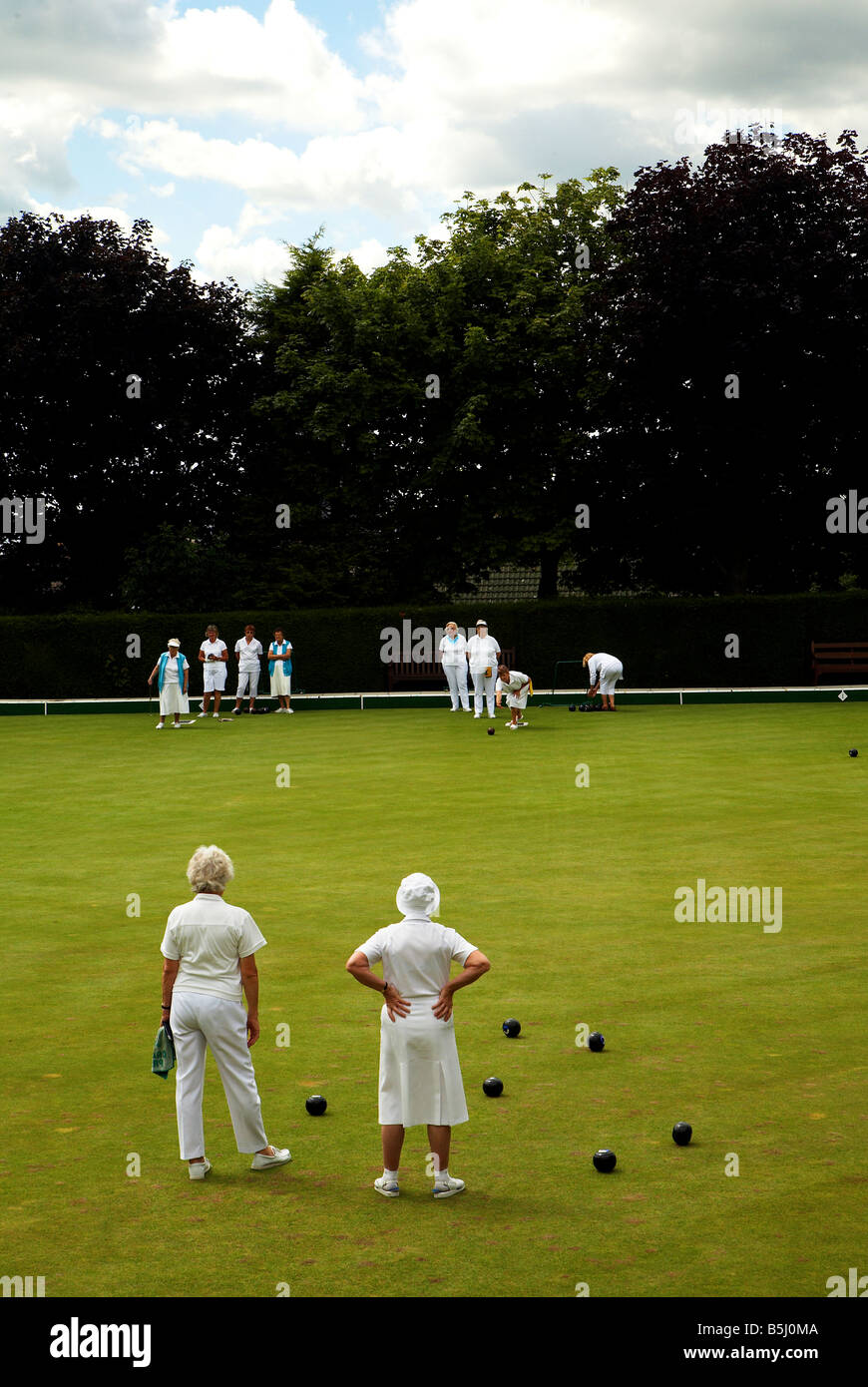 ladies plays bowls on a summer afternoon Stock Photo