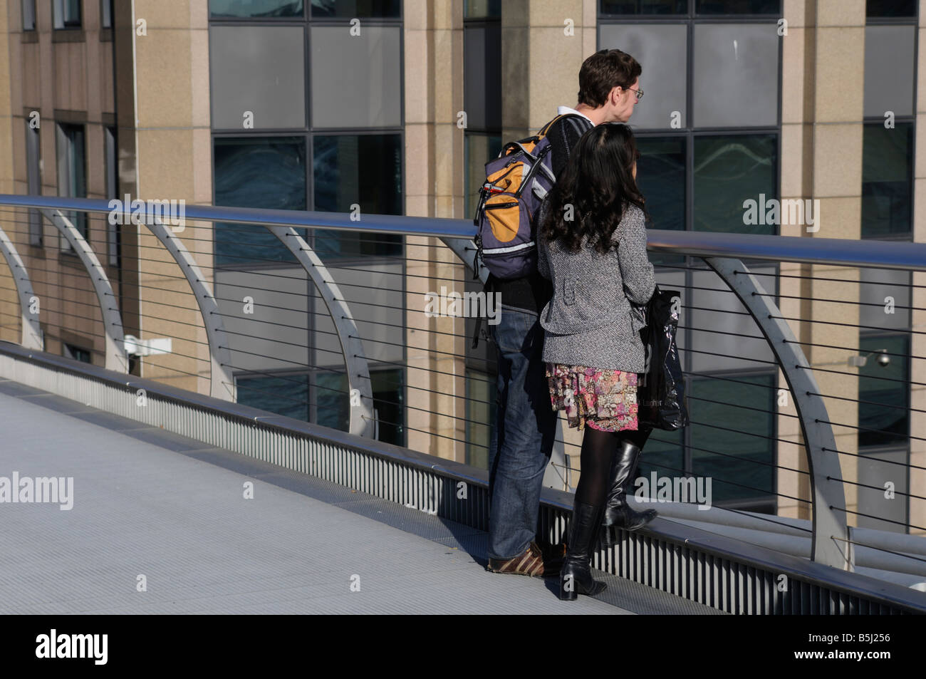 Young man standing bridge hi-res stock photography and images - Alamy