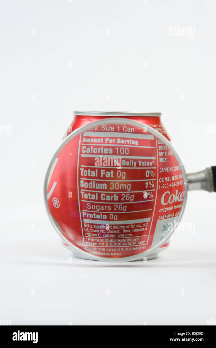 Nutrition label that lists the amount of fat, sodium, carbs, sugars and protein on Coca Cola Coke can. Stock Photo