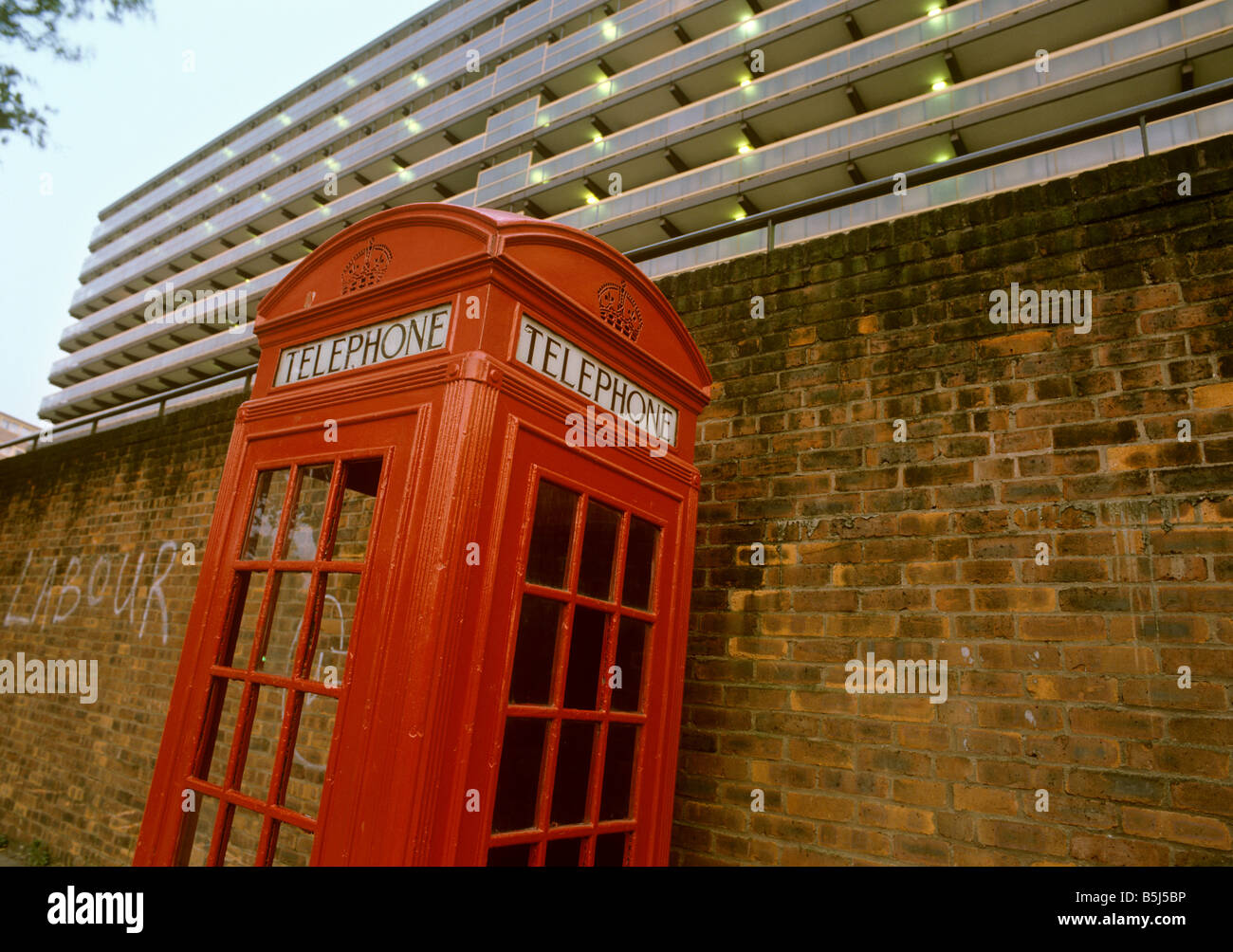 UK England London Elephant and Castle K2 phone box below block of council flats Stock Photo