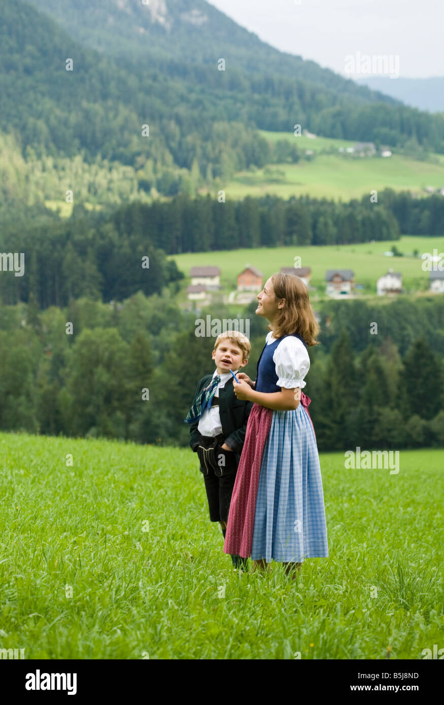 boy girl Austria national costume mountains Stock Photo - Alamy