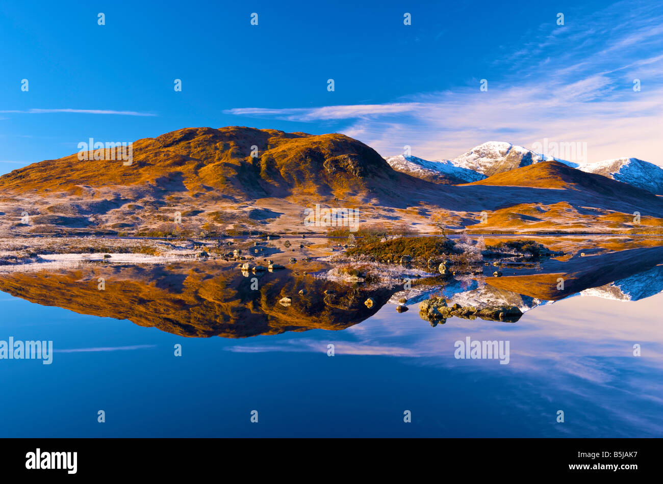 Reflections at dawn in Loch Tulla rannoch moor highlands scotland Stock Photo
