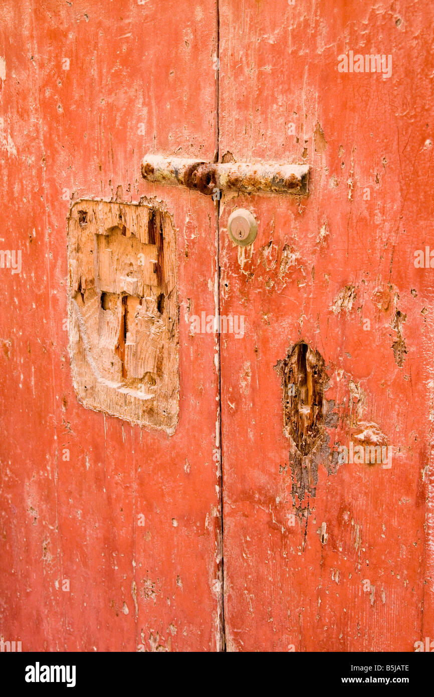 A detail of an old red door in the silent city of Mdina in Malta Stock Photo
