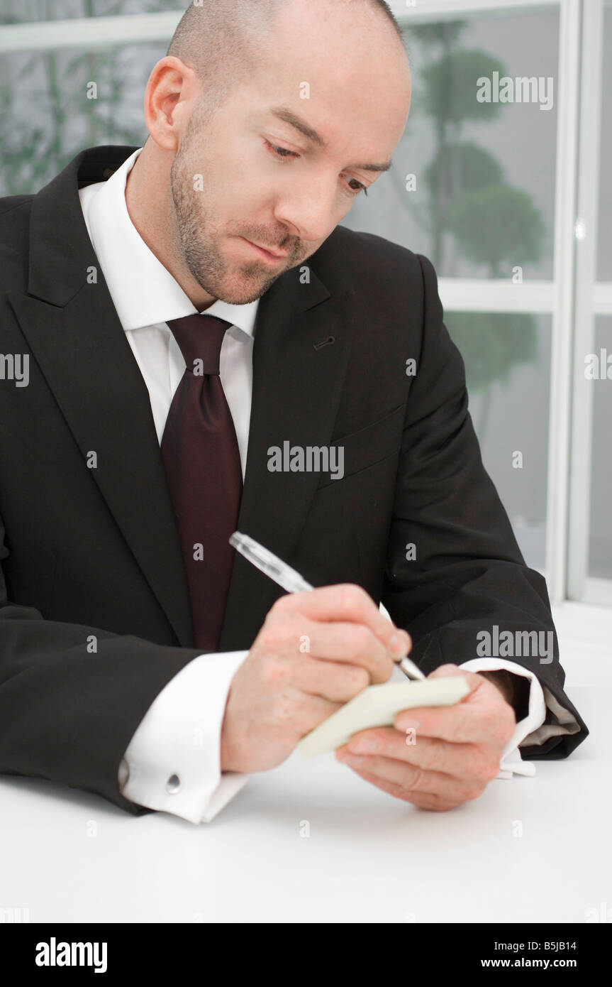 Male writing note hi-res stock photography and images - Alamy