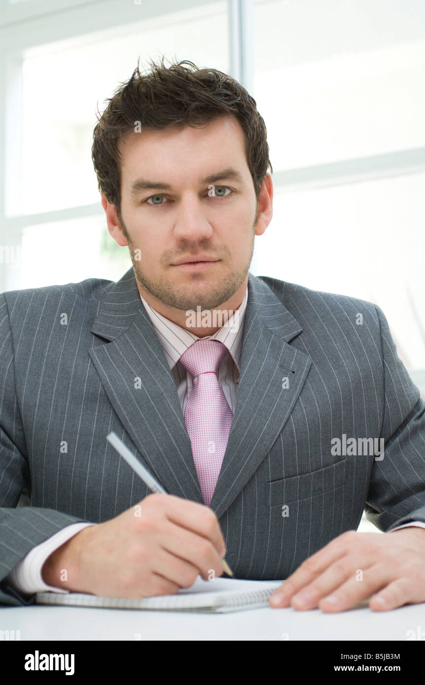 portrait of businessman making notes Stock Photo - Alamy
