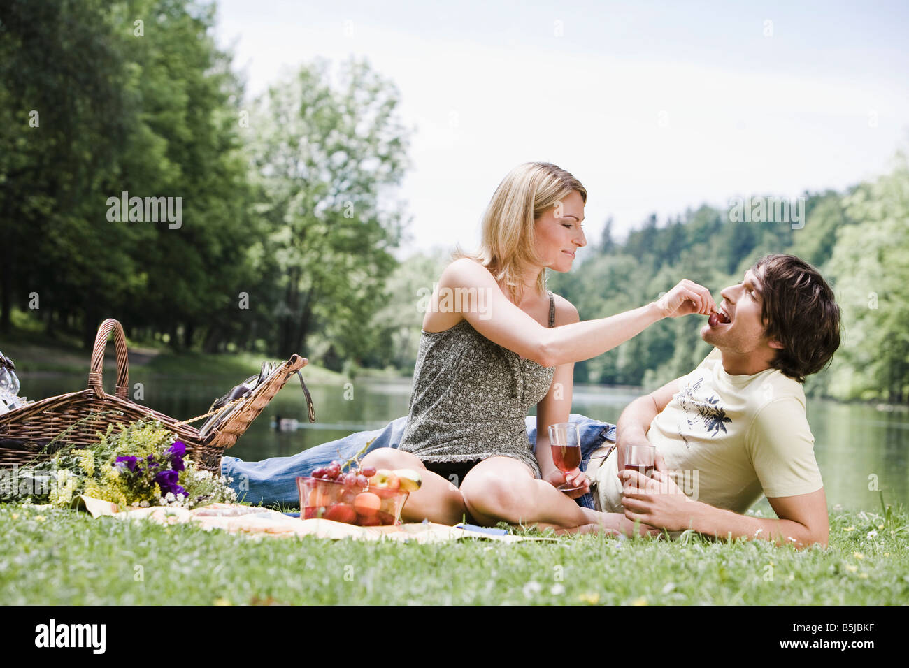 Young couple having picnic lake hi-res stock photography and images - Alamy