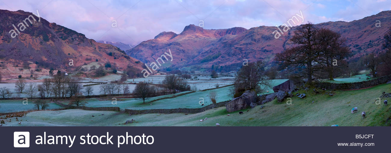 Panoramic view of the Langdale Pikes at sunrise, Langdale Valley, Lake District National Park, Cumbria, England, UK. Stock Photo