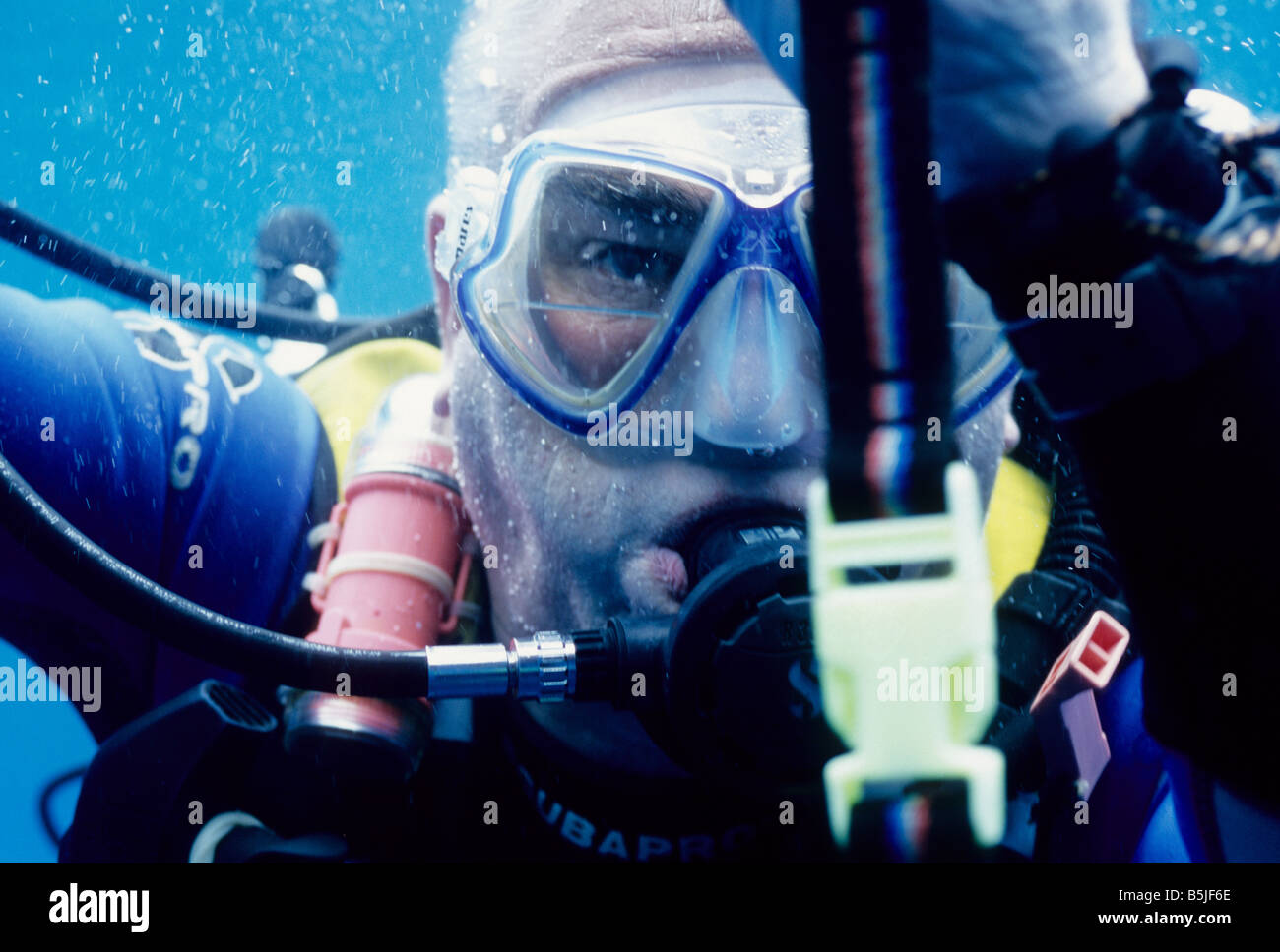 Scuba diver, Barry, close up on a safety stop in the ocean, Maldives
