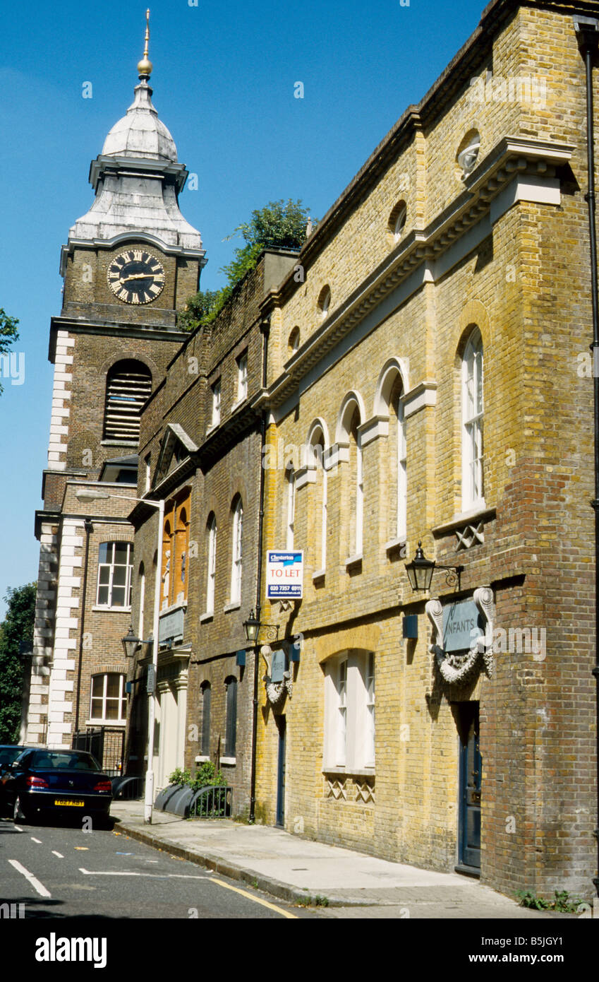 C18 Houses and tower of St John's church Wapping, in Scandrett Street, London E1 Stock Photo