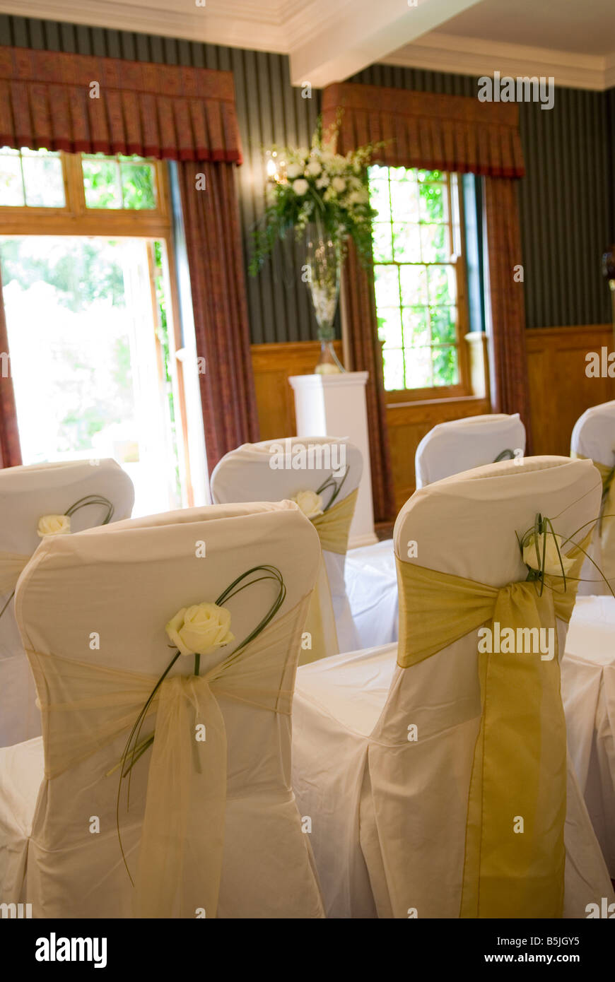 Chairs with tiebacks for a civil wedding ceremony Stock Photo Alamy