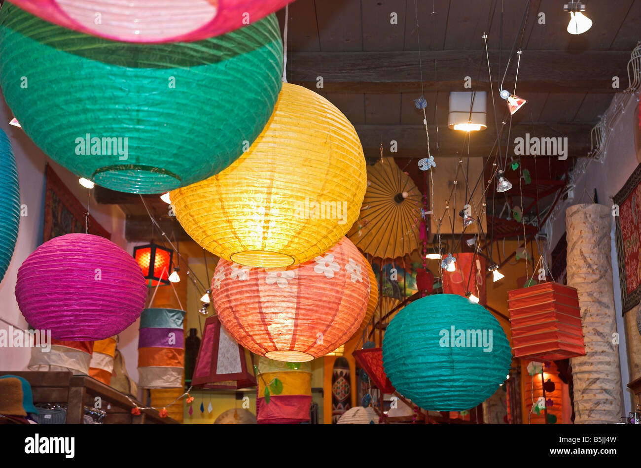 Colourful paper lanterns hanging in shop Stock Photo Alamy