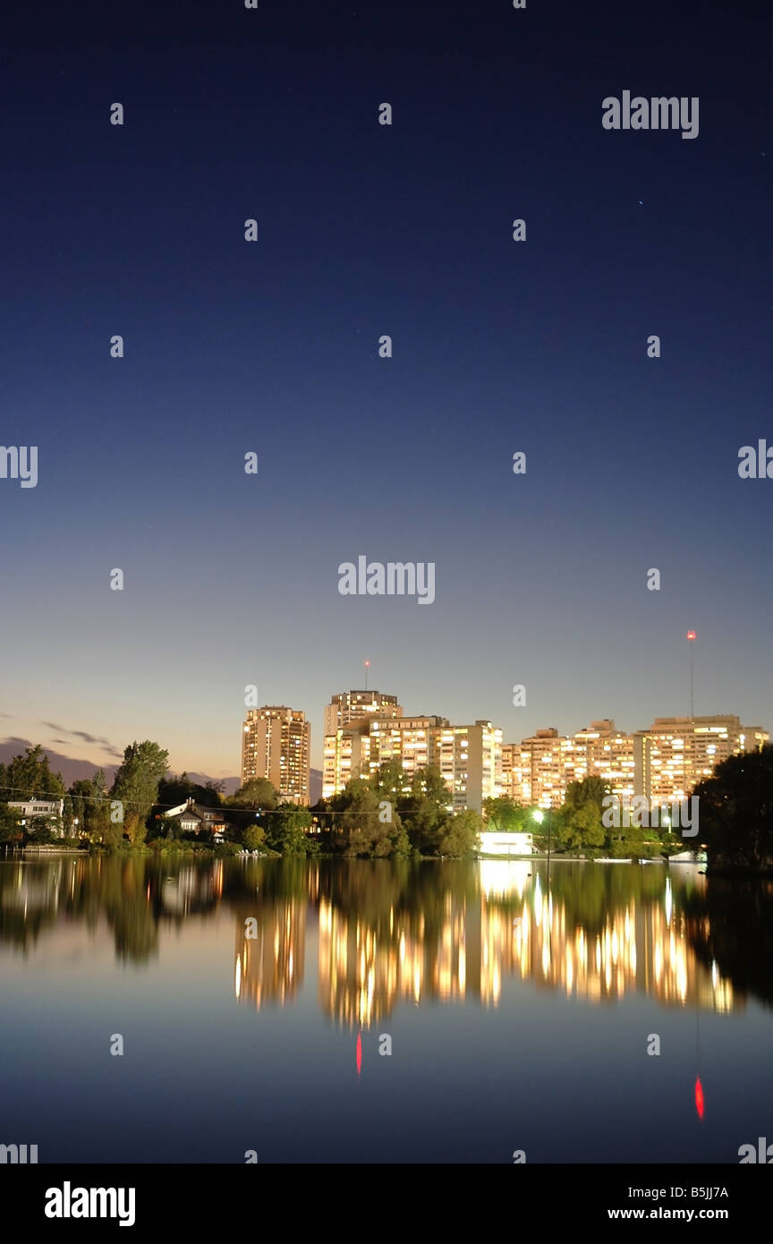 Brightly lit residential apartment buildings at Mooneys Bay waterfront